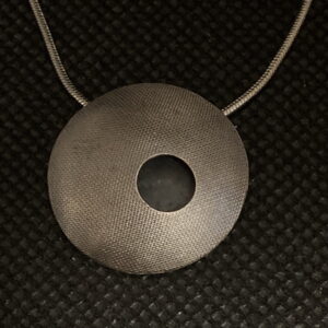 Artisanal, Handmade, mixed metal, silver and Brass "Pillow" textured and domed with 18" silver chain.