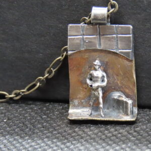 Wearable sculptural jewelry. You make up the story. Miniature silver human figures, on silver (oxidized) and upcycled brass. Approx. 1.5” x 2”