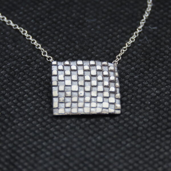 Sterling silver square with checkerboard pattern. 18" silver chain