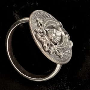 One-of-a-kind Victorian era metal button on sterling silver shank