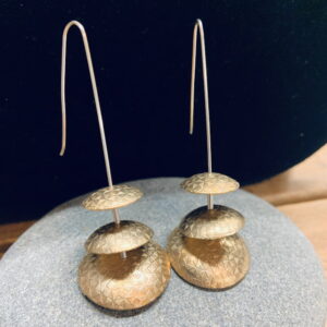 Unique, Handmade, textured, polished and domed brass discs, dangling from silver wires