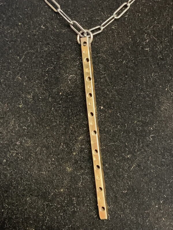 Oxidized brass thin square rod, drilled and stamped. 18" silver chain.